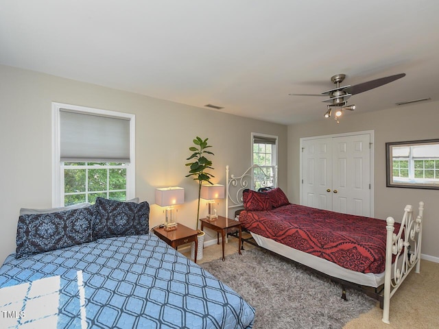 1005 Fairfax Woods Dr, Apex, NC 27502 - bedroom featuring carpet, a closet, and ceiling fan