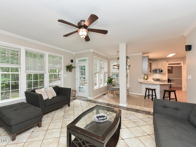 1005 Fairfax Woods Dr, Apex, NC 27502 - living area featuring light tile patterned floors, crown molding, ceiling fan, and plenty of natural light