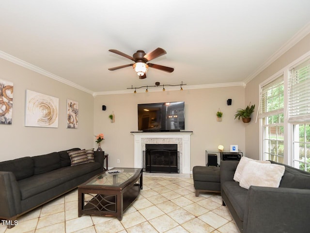 1005 Fairfax Woods Dr, Apex, NC 27502 - living room with crown molding, ceiling fan, a fireplace, and light tile patterned floors