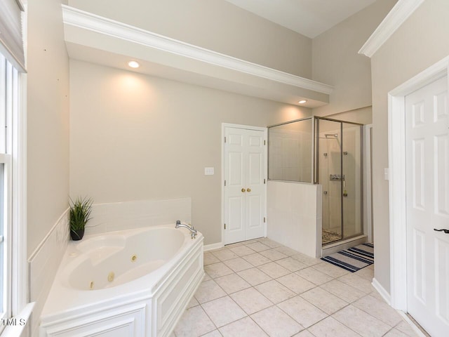 1005 Fairfax Woods Dr, Apex, NC 27502 - bathroom with a whirlpool tub, a shower stall, tile patterned flooring, and recessed lighting