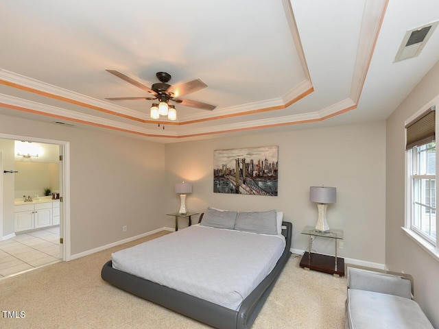 1005 Fairfax Woods Dr, Apex, NC 27502 - bedroom with a tray ceiling, crown molding, light carpet, ensuite bath, and ceiling fan