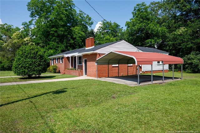 106 N 3rd St, Maxton, NC 28364 - back of property with a yard, a carport, driveway, and a chimney