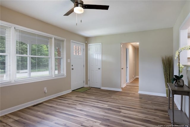 106 N 3rd St, Maxton, NC 28364 - entryway with wood finished floors and ceiling fan