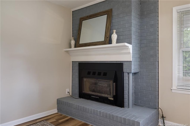 106 N 3rd St, Maxton, NC 28364 - detailed view of a fireplace and wood finished floors