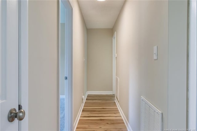 106 N 3rd St, Maxton, NC 28364 - corridor featuring light wood-style floors and baseboards