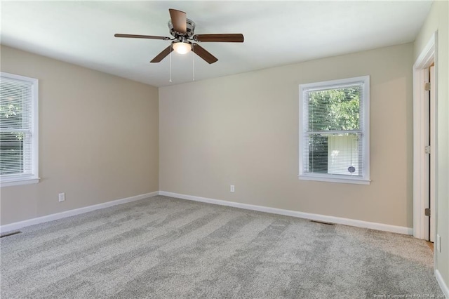 106 N 3rd St, Maxton, NC 28364 - spare room with carpet floors and ceiling fan