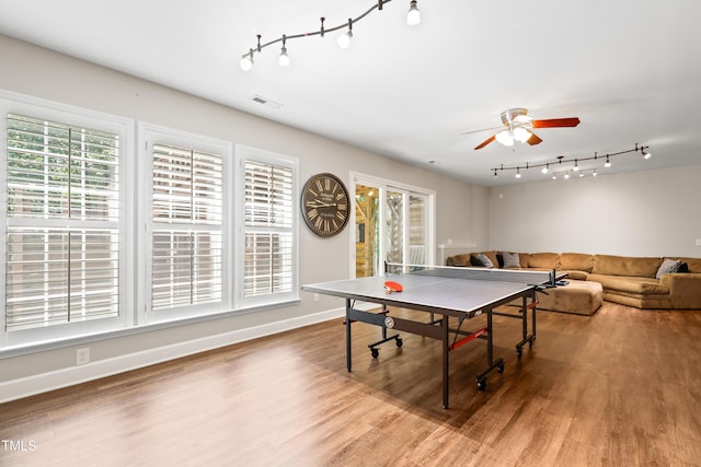 534 Siltstone Pl, Cary, NC 27519 - playroom featuring track lighting, a ceiling fan, and wood finished floors