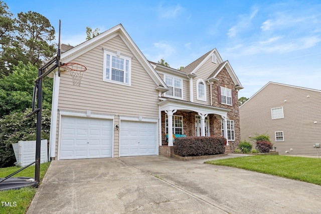 534 Siltstone Pl, Cary, NC 27519 - traditional-style home featuring a garage, covered porch, concrete driveway, and stone siding