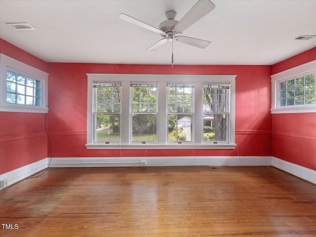 2400 Fairview Rd, Raleigh, NC 27608 - unfurnished room featuring plenty of natural light, hardwood / wood-style floors, and ceiling fan