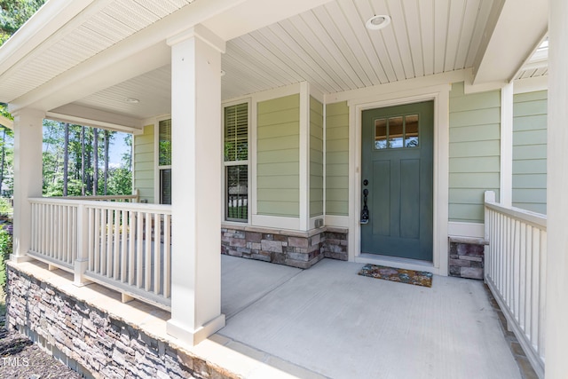 3504 Regent Pines Dr, New Hill, NC 27562 - view of exterior entry featuring covered porch and stone siding