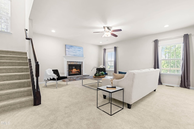 3504 Regent Pines Dr, New Hill, NC 27562 - living room with a ceiling fan, light colored carpet, a fireplace, stairway, and recessed lighting