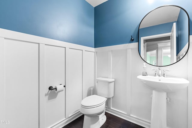 3504 Regent Pines Dr, New Hill, NC 27562 - bathroom with a decorative wall, a wainscoted wall, and wood finished floors