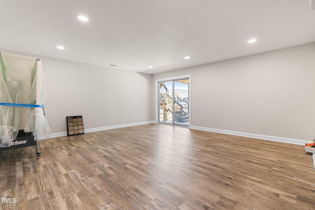 3504 Regent Pines Dr, New Hill, NC 27562 - unfurnished living room featuring wood finished floors and recessed lighting