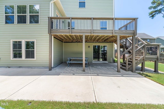 3504 Regent Pines Dr, New Hill, NC 27562 - rear view of house with a patio area and a deck