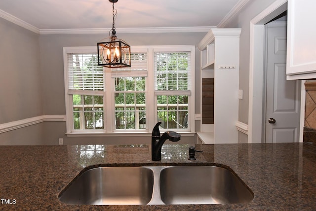3209 Leebrook Rd, Raleigh, NC 27616 - kitchen with dark stone counters, a chandelier, decorative light fixtures, ornamental molding, and white cabinets