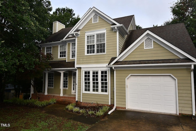 3209 Leebrook Rd, Raleigh, NC 27616 - traditional home featuring a porch, an attached garage, a chimney, driveway, and roof with shingles