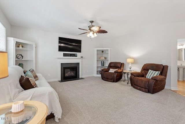 3921 Robins Nest Ln, Wake Forest, NC 27587 - living room with ceiling fan, a fireplace with flush hearth, and carpet flooring