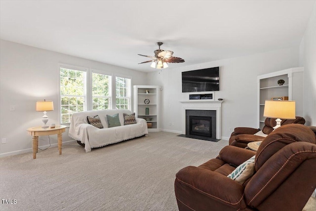 3921 Robins Nest Ln, Wake Forest, NC 27587 - living room with ceiling fan, carpet, and a fireplace with flush hearth
