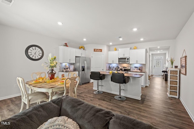 2730 Spring Valley Dr, Creedmoor, NC 27522 - living area with dark wood-type flooring and recessed lighting