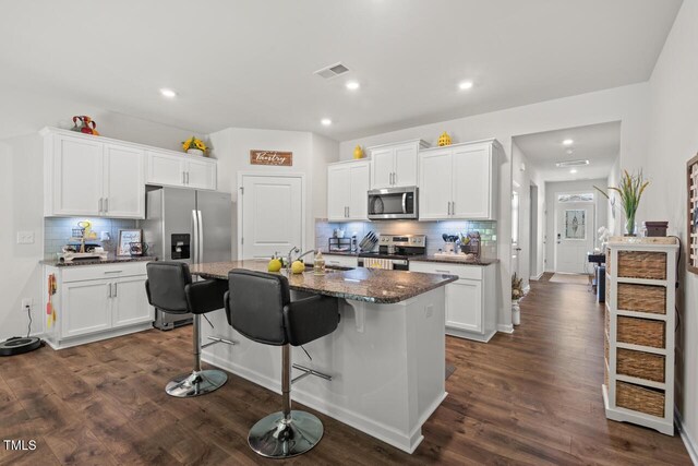 2730 Spring Valley Dr, Creedmoor, NC 27522 - kitchen featuring appliances with stainless steel finishes, decorative backsplash, white cabinets, and recessed lighting