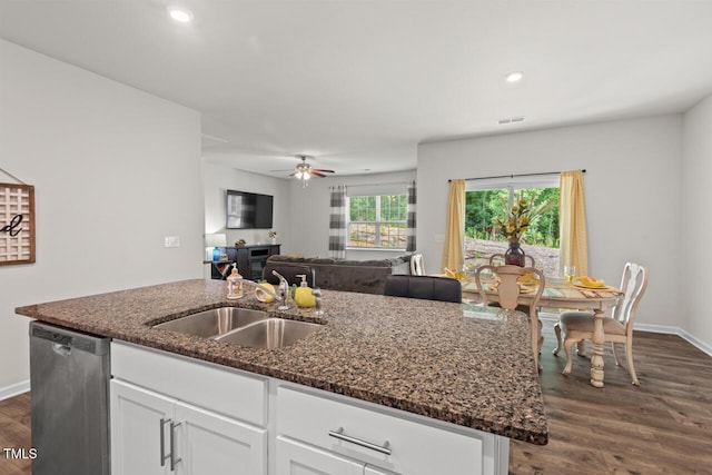 2730 Spring Valley Dr, Creedmoor, NC 27522 - kitchen with dishwasher, a center island with sink, dark stone counters, dark wood-style flooring, and white cabinets