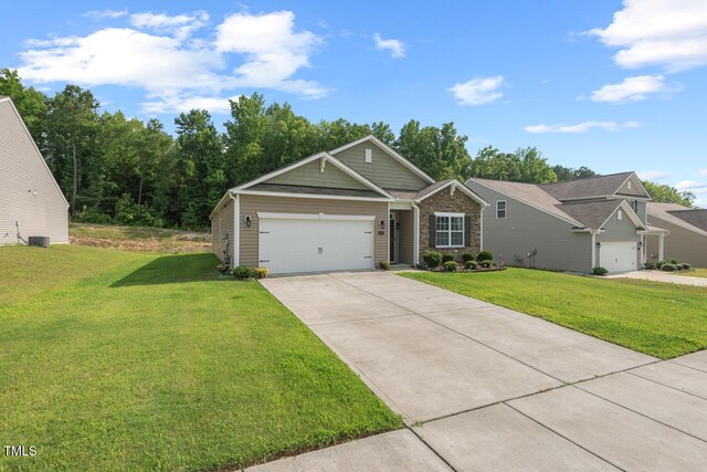 2730 Spring Valley Dr, Creedmoor, NC 27522 - view of front facade with a front lawn, concrete driveway, and an attached garage