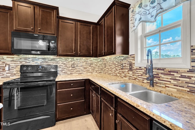 48 Manito Pl, Clayton, NC 27520 - kitchen featuring black appliances, dark brown cabinetry, backsplash, and light stone countertops