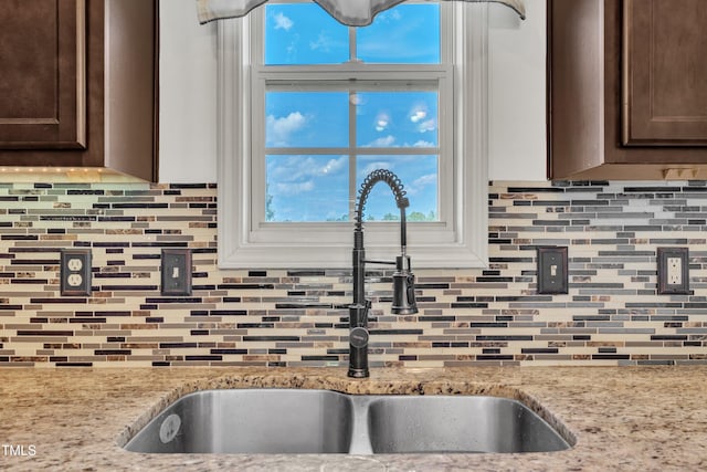 48 Manito Pl, Clayton, NC 27520 - kitchen with dark brown cabinetry and backsplash