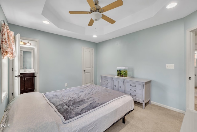 48 Manito Pl, Clayton, NC 27520 - bedroom with a raised ceiling, recessed lighting, light carpet, a ceiling fan, and ensuite bathroom