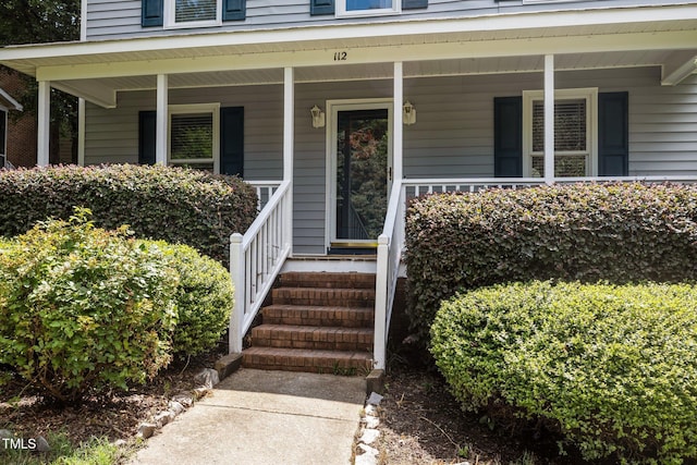 112 Autumn Ridge Dr, Knightdale, NC 27545 - view of exterior entry featuring a porch