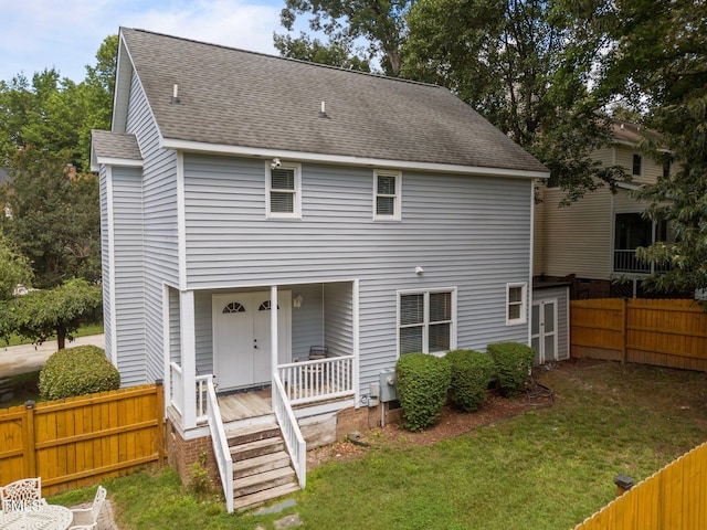 112 Autumn Ridge Dr, Knightdale, NC 27545 - rear view of property with roof with shingles and a porch