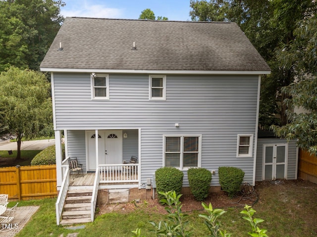 112 Autumn Ridge Dr, Knightdale, NC 27545 - back of house with a porch and roof with shingles