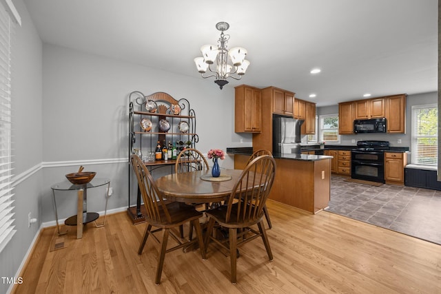 112 Autumn Ridge Dr, Knightdale, NC 27545 - dining space featuring a chandelier, light wood-type flooring, and recessed lighting