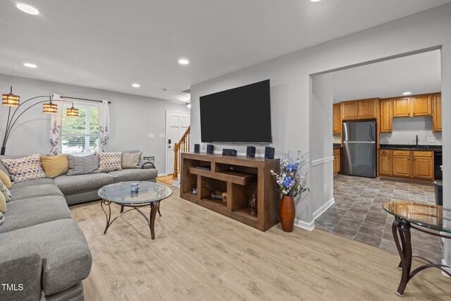 112 Autumn Ridge Dr, Knightdale, NC 27545 - living room with wood finished floors, recessed lighting, and stairway