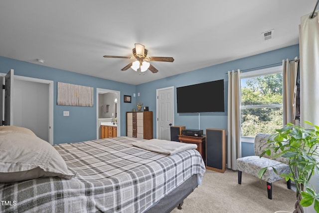 112 Autumn Ridge Dr, Knightdale, NC 27545 - bedroom with light carpet, a ceiling fan, and ensuite bath