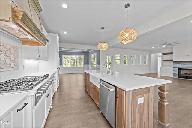 543 Allessandra Dr, Clayton, NC 27527 - kitchen featuring stainless steel appliances, custom range hood, light wood-type flooring, decorative backsplash, and recessed lighting
