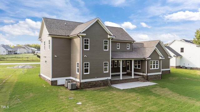 543 Allessandra Dr, Clayton, NC 27527 - back of property with a patio area, a lawn, crawl space, and a shingled roof