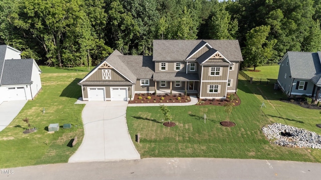 543 Allessandra Dr, Clayton, NC 27527 - view of front of home with board and batten siding, concrete driveway, and a front yard