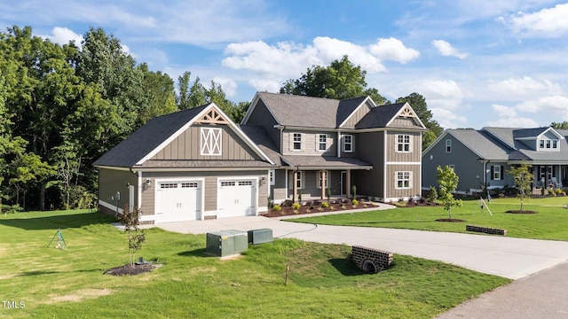 543 Allessandra Dr, Clayton, NC 27527 - craftsman inspired home with board and batten siding, a front lawn, concrete driveway, and a garage