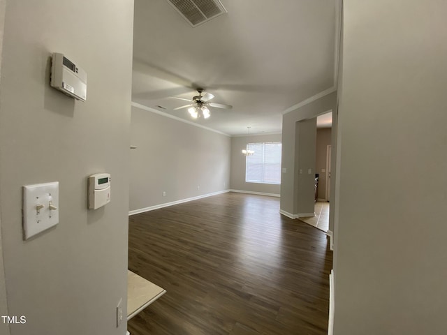 545 Writers Way, Morrisville, NC 27560 - empty room with ornamental molding, dark wood-style floors, a ceiling fan, and a chandelier