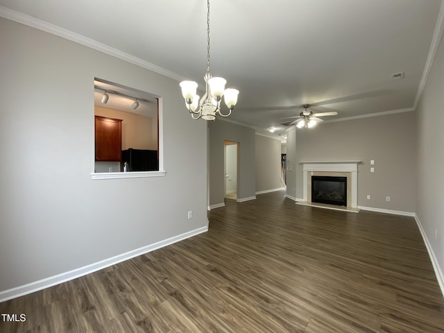 545 Writers Way, Morrisville, NC 27560 - unfurnished living room featuring ceiling fan, dark wood-style flooring, a premium fireplace, ornamental molding, and a chandelier