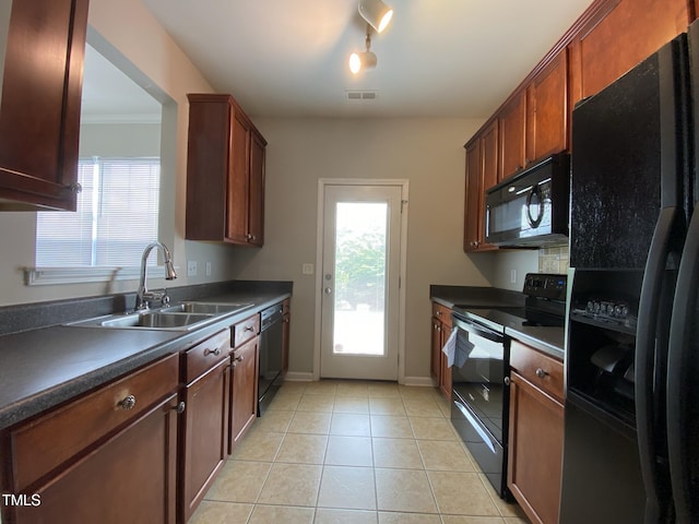 545 Writers Way, Morrisville, NC 27560 - kitchen with black appliances, dark countertops, and light tile patterned floors