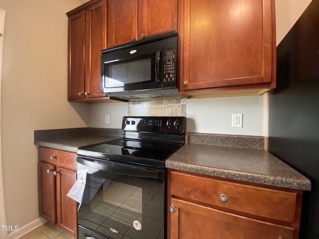 545 Writers Way, Morrisville, NC 27560 - kitchen featuring black appliances, dark countertops, and light tile patterned floors