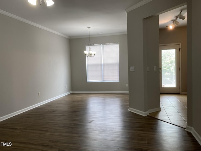 545 Writers Way, Morrisville, NC 27560 - empty room featuring a chandelier, dark wood finished floors, and crown molding