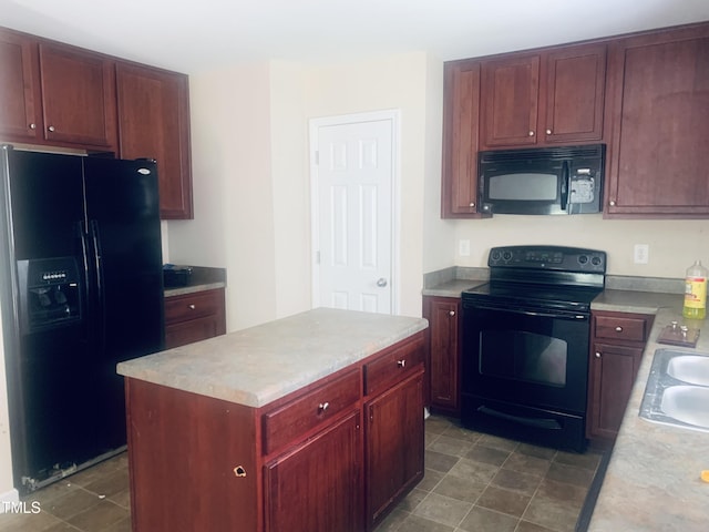 5908 Abbington Way, Raleigh, NC 27610 - kitchen featuring black appliances, dark brown cabinets, light countertops, and a center island