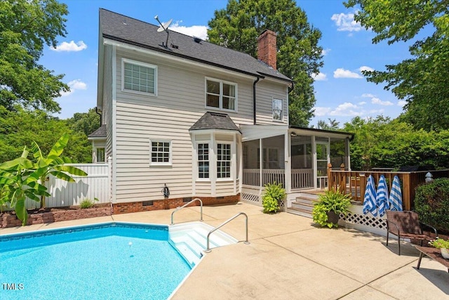 5833 Dahlberg Dr, Raleigh, NC 27603 - rear view of house with a sunroom, a patio area, a chimney, a shingled roof, and crawl space