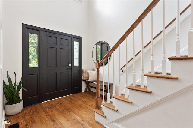 5833 Dahlberg Dr, Raleigh, NC 27603 - foyer with stairway and wood finished floors