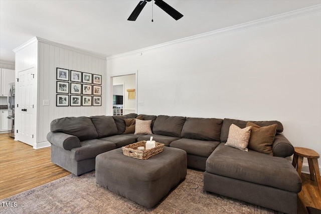 5833 Dahlberg Dr, Raleigh, NC 27603 - living room with ornamental molding, light wood-type flooring, and a ceiling fan