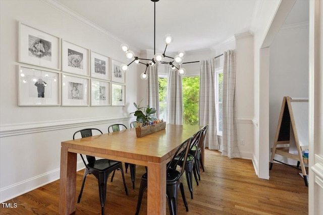 5833 Dahlberg Dr, Raleigh, NC 27603 - dining room with a chandelier, crown molding, and light wood-style floors