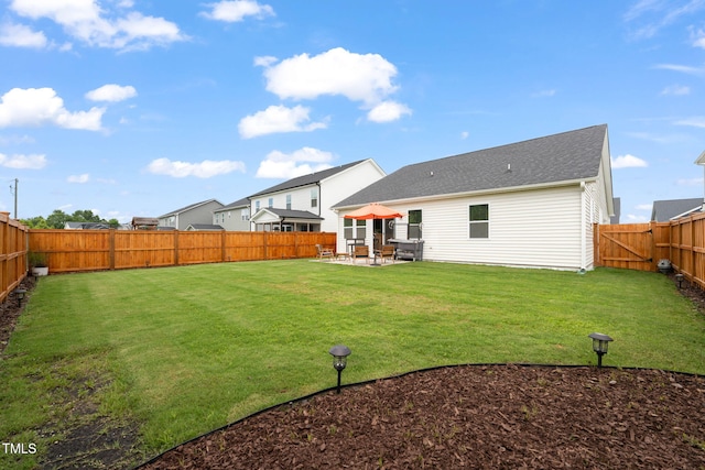 1109 Briar Gate Dr, Holly Springs, NC 27540 - back of property with a patio and a fenced backyard
